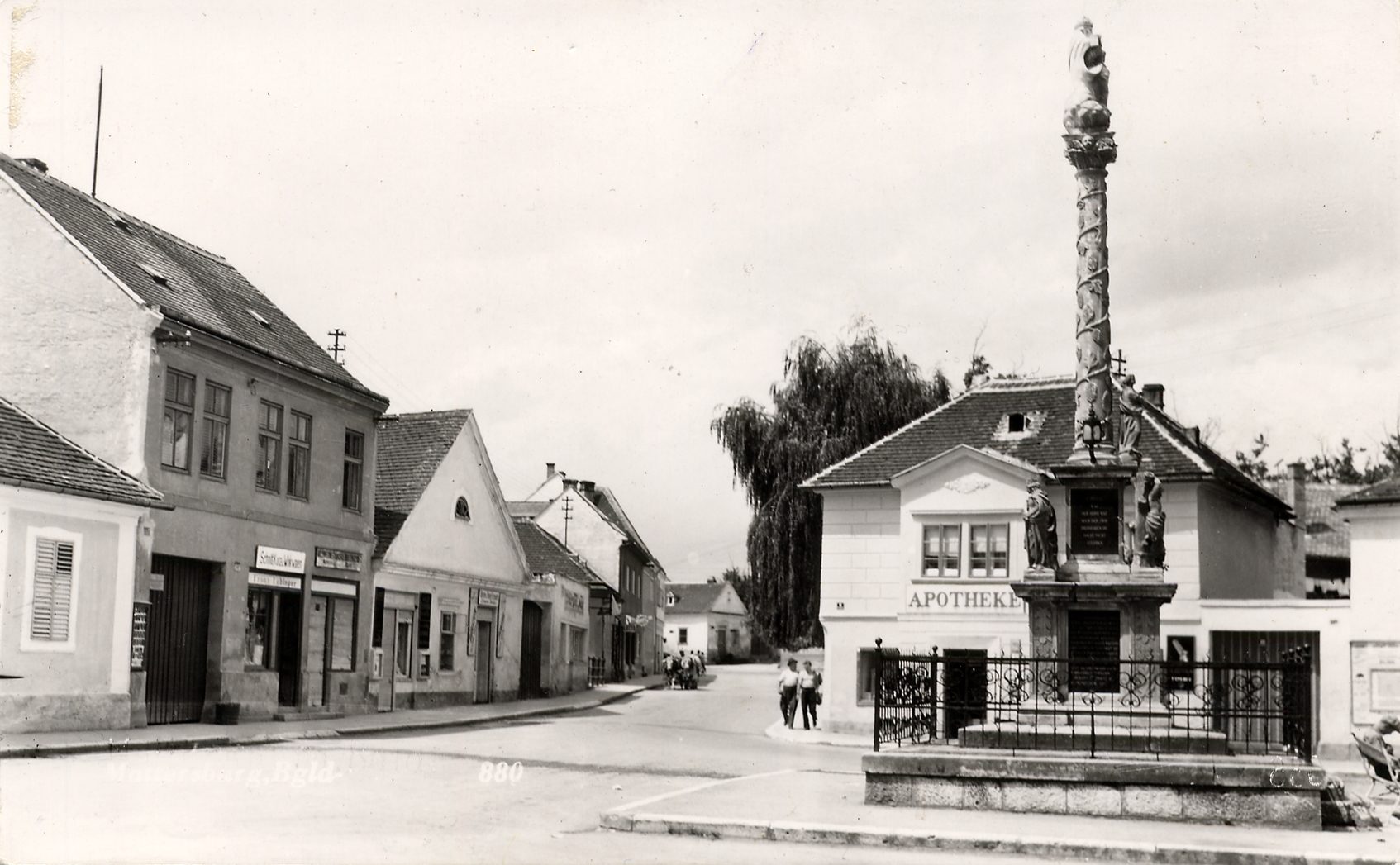 Historical postcard of the Hauptplatz in Mattersburg with the Trinity column and the pharmacy.
