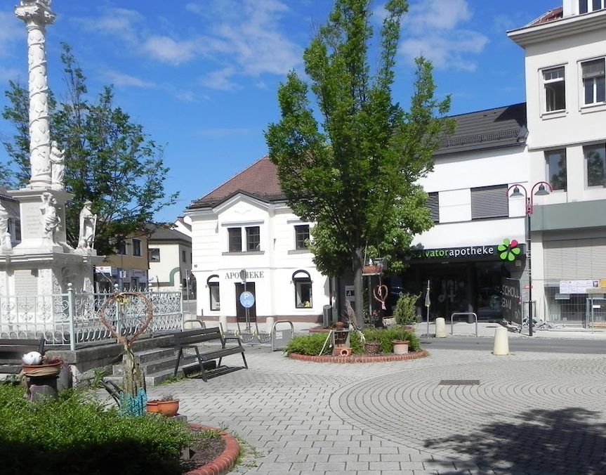 The Hauptplatz in Mattersburg today, with the Trinity column and the Salvator pharmacy.